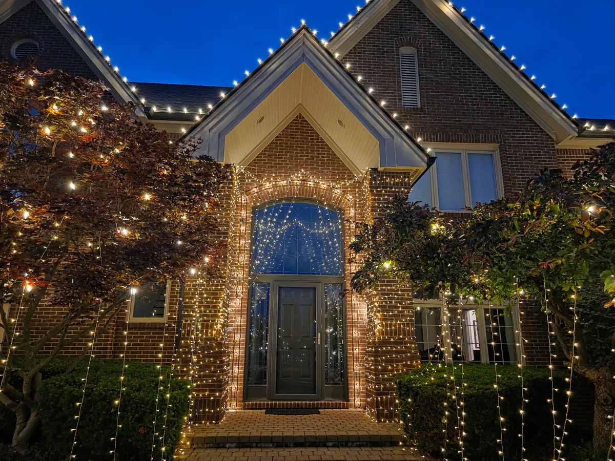 Architectural uplighting in blue and purple on a commercial building exterior