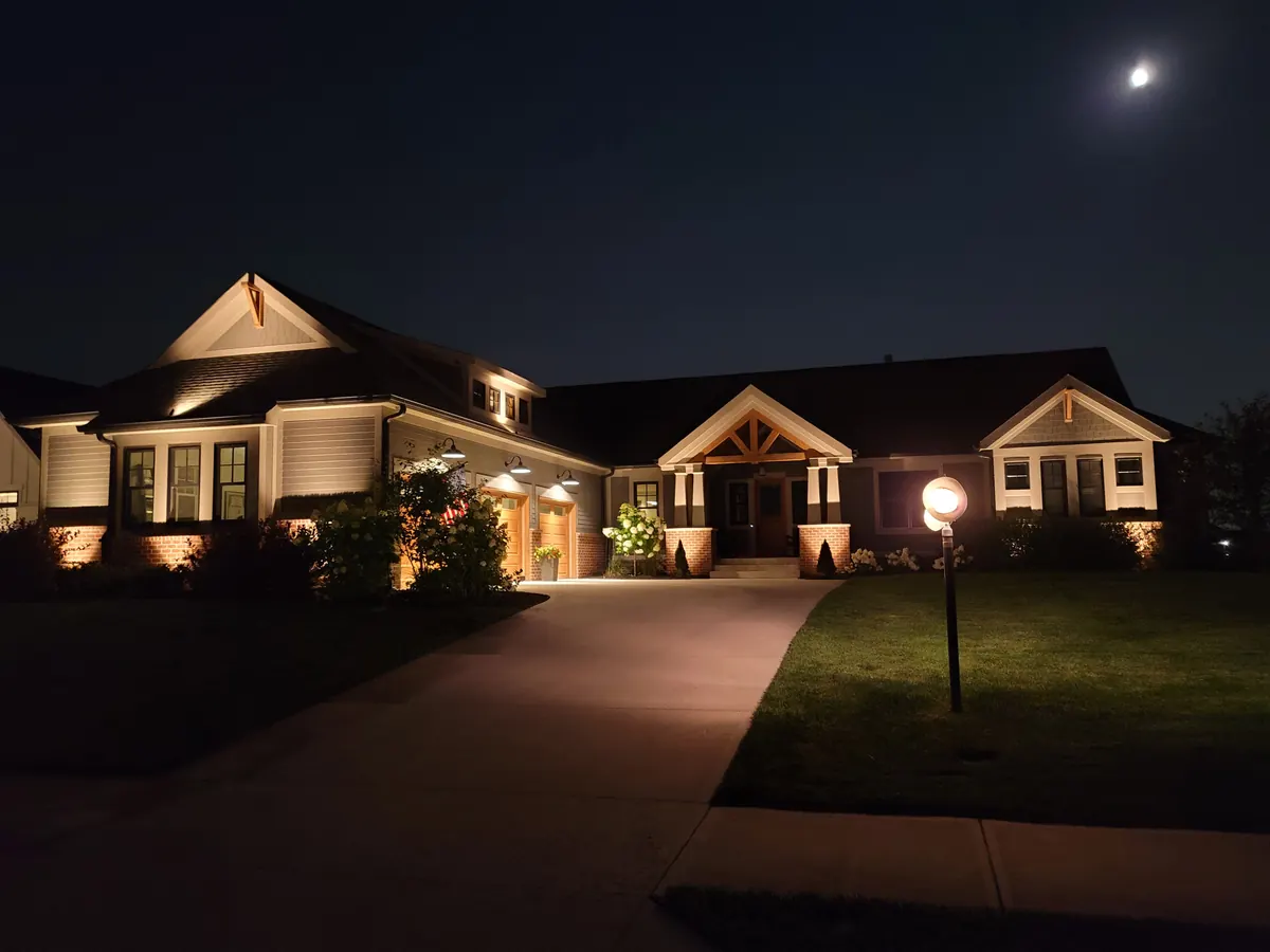 Driveway approach with pathway uplighting and accent landscape lighting